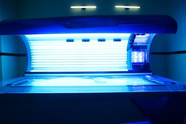Tanning solarium light machine blue color clipart