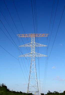 Electric high tower strcture blue sky clipart