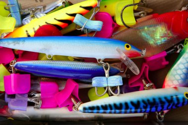 Colorful fishing saltwater fish lures box clipart