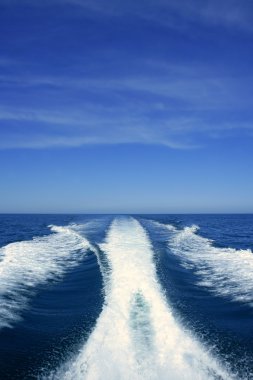 Boat white wake on the blue ocean sea clipart