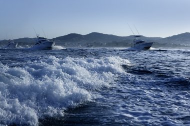 Fishing boat in a big game summer blue morning clipart