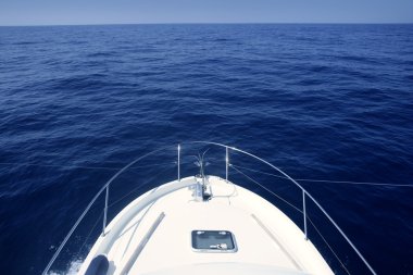 Bow of yacht white boat cruing the blue sea clipart