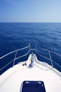 Blue ocean sea view from motorboat yacht bow clipart