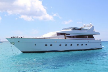 Luxury yacht in turquoise Illetes Formentera clipart