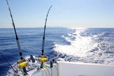 Trolling offshore fisherboat rod reels wake sea clipart