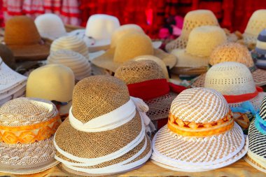 Hats arrangement on market hand craft shop clipart