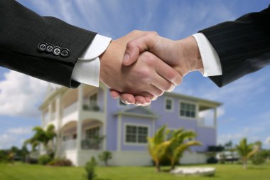 Businessman real state handshake partners