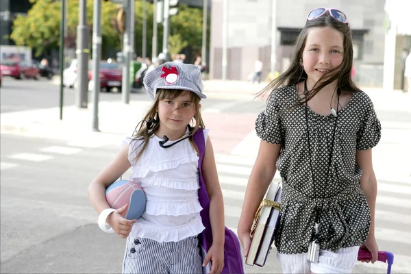 Little student girls going to school in city — Stock Photo, Image