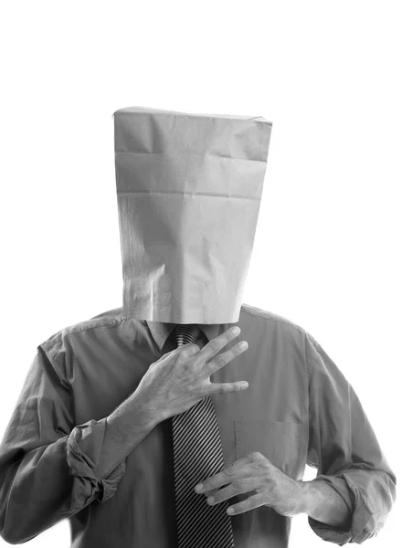 Бизнесмен с бумажным пакетом в голове — стоковое фото
