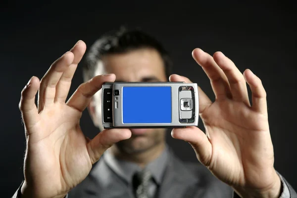 Businessman taking photos, mobile camera — Stock Photo, Image