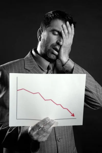 Businessman with bad sales reports chart — Stock Photo, Image