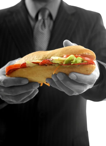 Empresario comiendo chatarra comida rápida — Foto de Stock