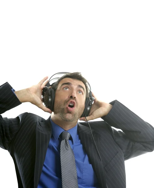 Hombre de negocios oyendo, cantando música, auriculares — Foto de Stock