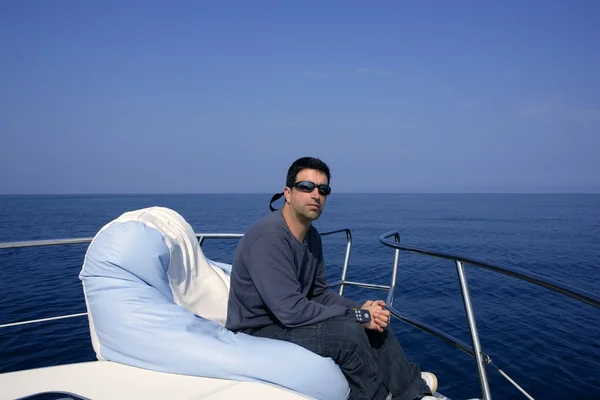 Man on bow boat relaxed on bean bag — Stock Photo, Image