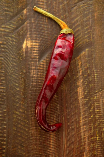 Röda torkade hoade Chilipeppar — Stockfoto