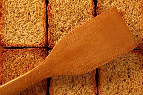 Gouden geroosterd brood plakjes in rijen — Stockfoto