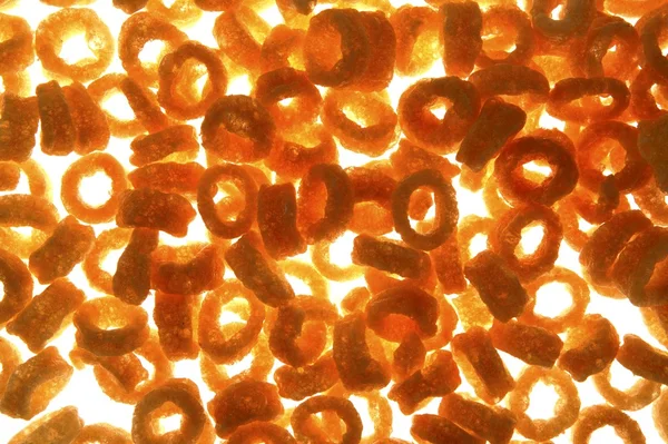Round corn snack rings texture — Stock Photo, Image