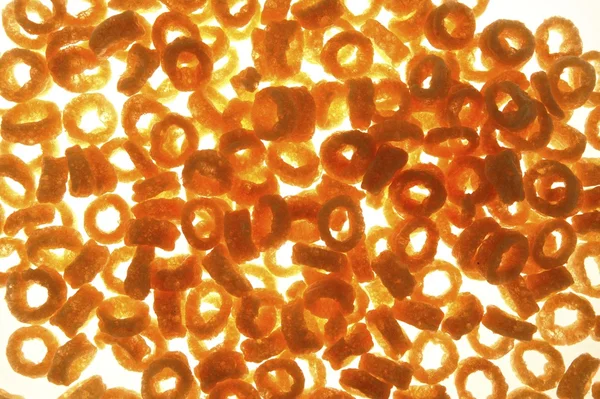 Round corn snack rings texture — Stock Photo, Image