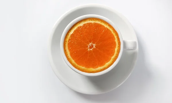 Orange slice in a coffee cup — Stock Photo, Image