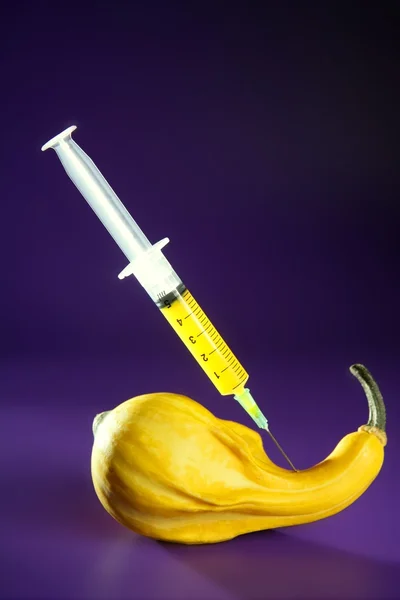Yellow pumpkin and syringe — Stock Photo, Image