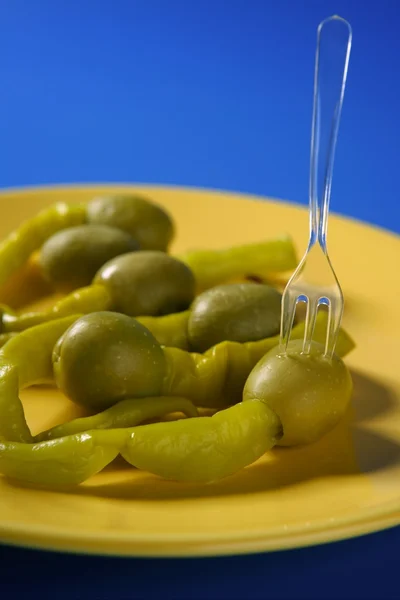 Olives and hot green pepper snack — Stock Photo, Image