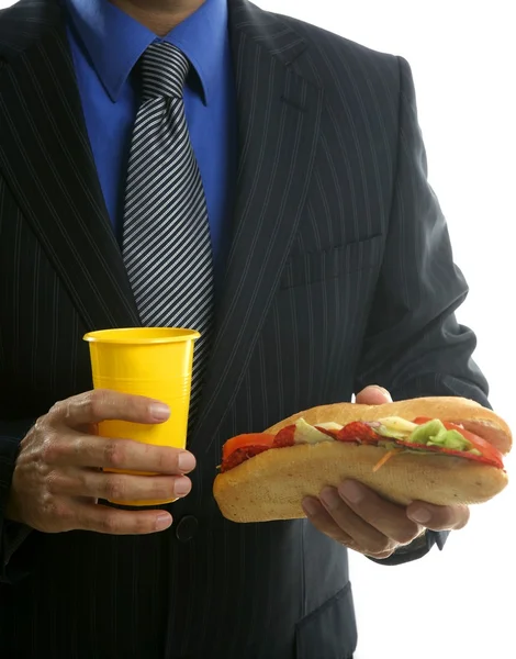 Uomo d'affari mangiare spazzatura fast food — Foto Stock