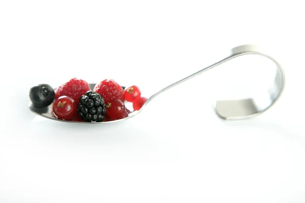 Berries in a spoon — Stock Photo, Image