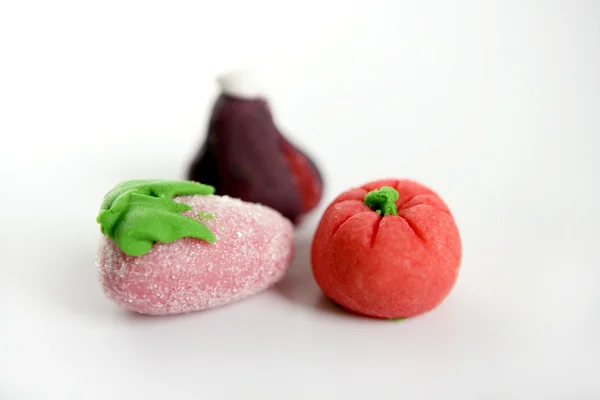 Variety of fruits on colorful marzipan — Stock Photo, Image
