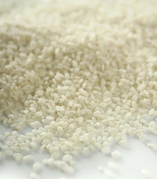 Witte rijst close-up textuur. patroon van de achtergrond — Stockfoto