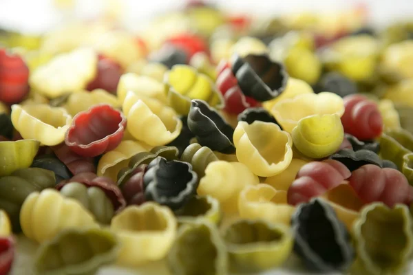 Italské těstoviny textura, tvar shell škeble — Stock fotografie