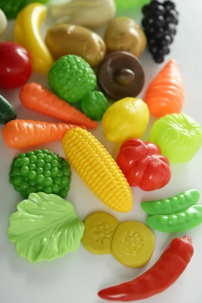Plastic game, fake varied vegetables and fruits — Stock Photo, Image
