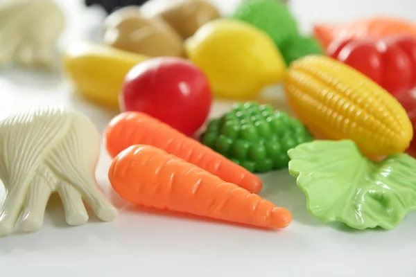 Plastic game, fake varied vegetables and fruits — Stock Photo, Image