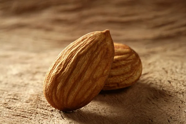 Almond macro over wood background — Stock Photo, Image