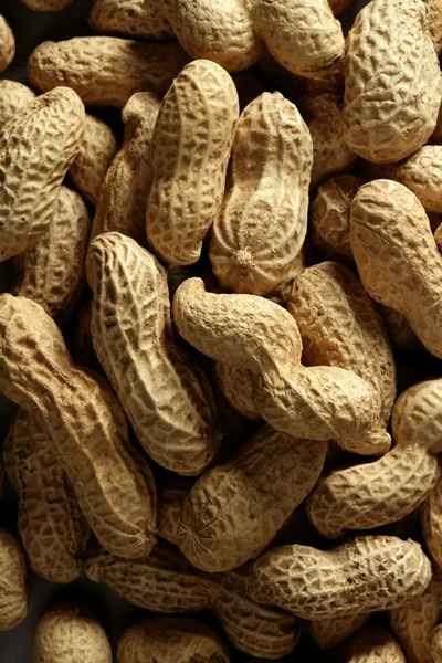 Peanuts macro over wood background — Stock Photo, Image
