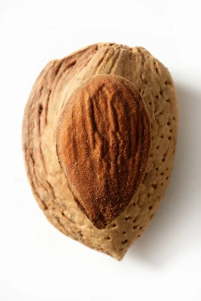 Almond macro image over white background — Stock Photo, Image