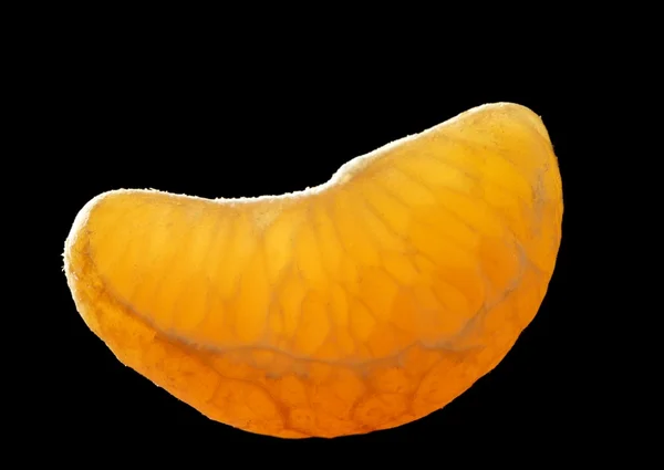Tangerine macro segment over black — Stock Photo, Image