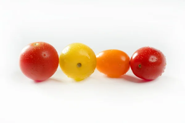 Pequena cereja variada multi tomates coloridos — Fotografia de Stock