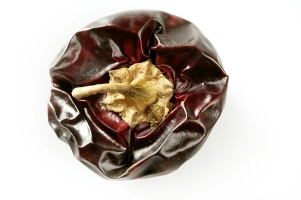 One round Mediterranean dried dark red peppers — Stock Photo, Image