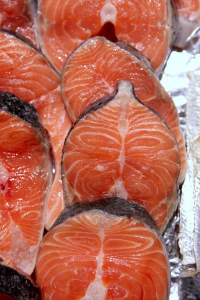 stock image Salmon fish vivid slices in a row