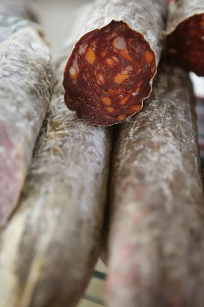 Cured red pepperoni in the mediterranean market — Stock Photo, Image