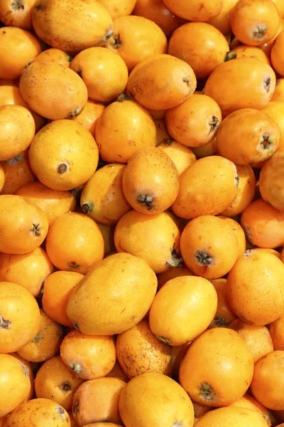 Medlar fruits pattern background texture market — Stock Photo, Image