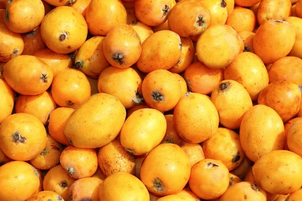 Medlar fruits pattern background texture market — Stock Photo, Image