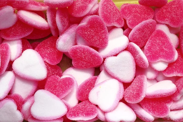 Dulces de jalea caramelo rosa forma de corazón blanco — Foto de Stock