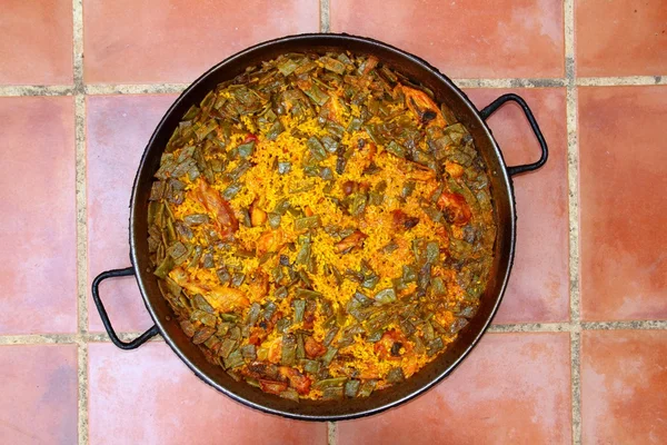 Receita de arroz Paella Mediterrâneo Espanha redondo pan — Fotografia de Stock