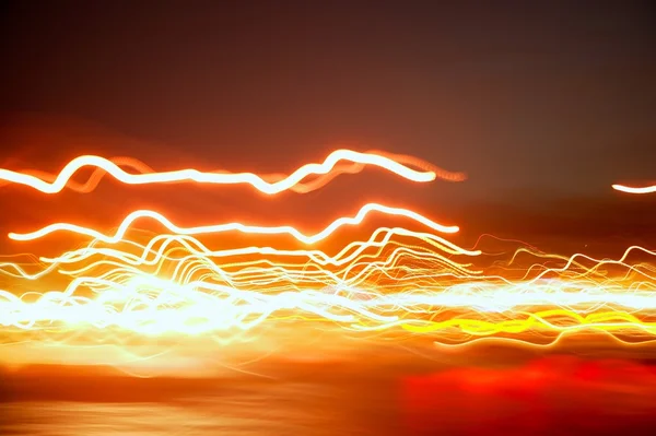 Bulanık gece kırmızı şehir ışıkları taşıma — Stok fotoğraf