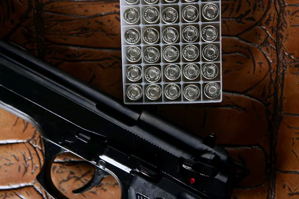 Black pistol handgun with bullet box — Stock Photo, Image