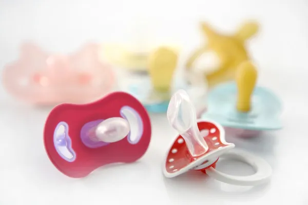 Baby pacifier set over white background — Stock Photo, Image