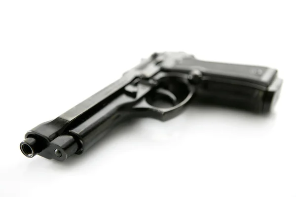 Pistola mão preta sobre fundo branco — Fotografia de Stock
