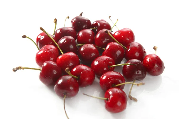 Cherry red wet fruits macro on white — Stock Photo, Image