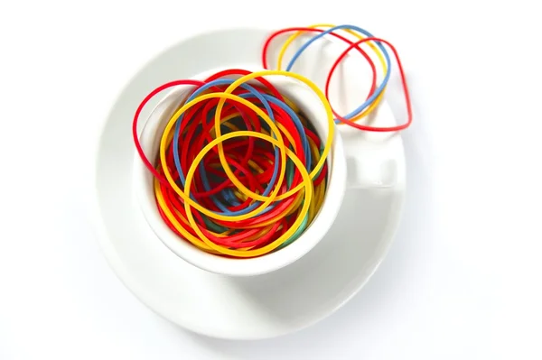 Kaffee-Metapher mit farbigen Gummibändern, Büro — Stockfoto